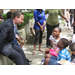 Man talking to three children